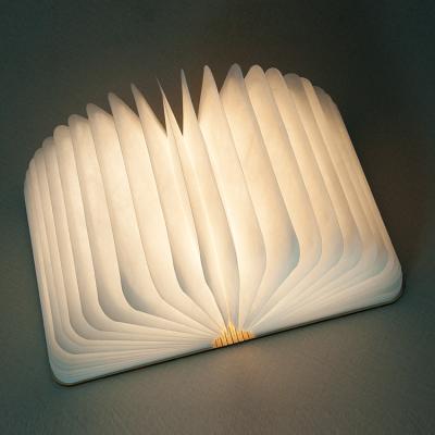 China Mini Folding Light Dupont Waterproof Mini Paper Folding Book Lamp LED Lumio Wooden Book Shaped Led Book Light for sale