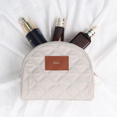 China Wholesale Recycled / Eco-friendly Nylon Comforter Pouch Zippered Makeup Cosmetic Bag With Letter Patches Logo for sale