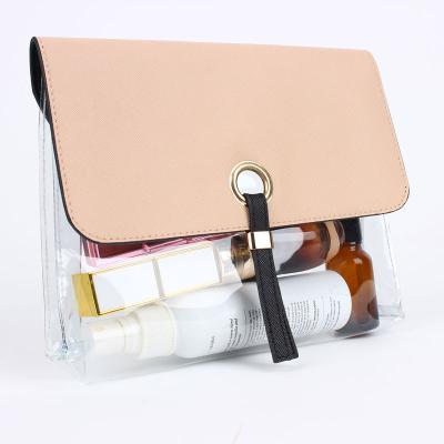 China Waterproof custom tpu and pu leather transparent plastic waterproof travel makeup clear pink cosmetic organize bag with snap buckle for sale