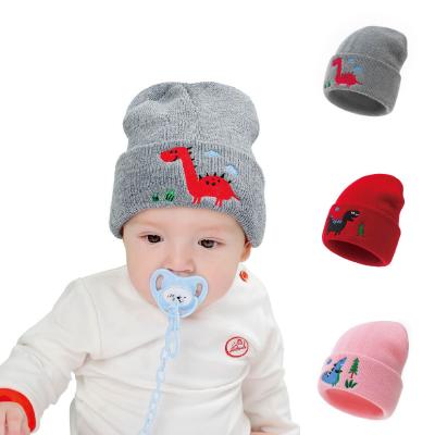 China New Comfortable Embroidered Dinosaur Knit Children's Hats With Dome Buckles Winter Children's Warm Hats And Caps for sale