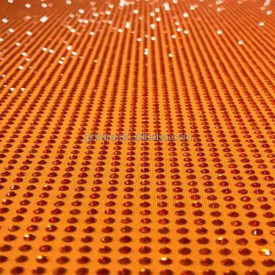 China Shinning red elastic high quality diamante stone stretch rhinestone mesh fabric for clothing for sale