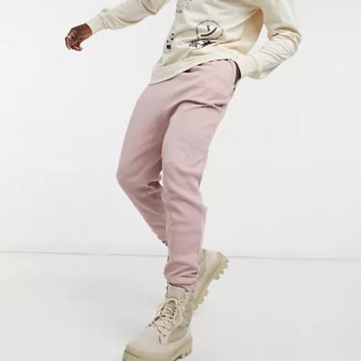 China Anti-pilling new fashion custom sweatpants drop crotch men cotton pink sweatpants for sale