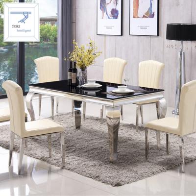 China Durable Luxury Stainless Steel Dining Table Set With 6 PCS Chairs for sale