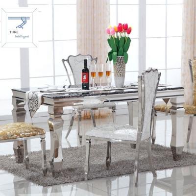 China Durable Luxury 1.5M Stainless Steel Dining Table Set With 6 PCS Chairs for sale