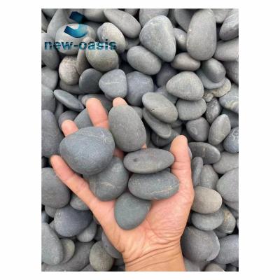 Cina Black unpolished river pebble stone in vendita