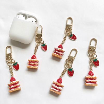 China Promotion Gift Cake Strawberry Key Chain For Airpods Case Ornament Accessories Bluetooth Earphone Silicone Cover Car Key Ring Gift for sale