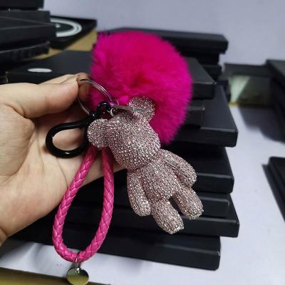 China Hot Selling Fashion Keychains Fashion Luxury Leather Braided Strand Full Pom Pom Keychains Crystal Bear Pendant Keyring Fluffy for sale