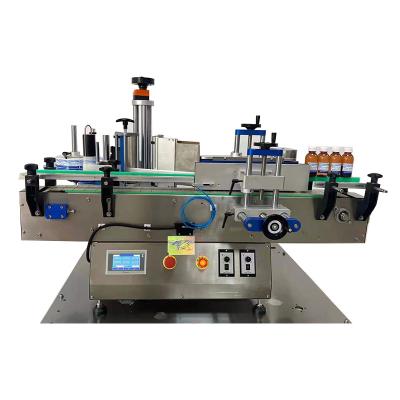 China Beverage low price sticker labeling applicator small round bottle labeling machine for glass/plastic bottles with adhesive label for sale