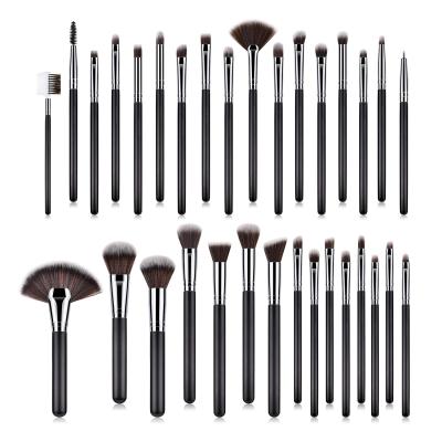 China Angular Blush OCM 32 Piece Professional Black Wood Handle Kabuki Cosmetic Beauty Makeup Brush Set for sale