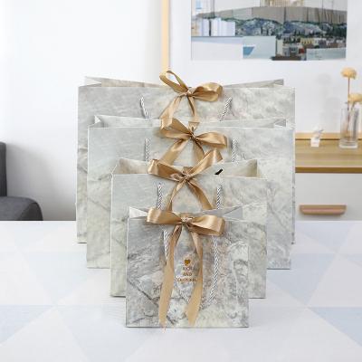 China Custom Made Wedding Biodegradable Paper Candy Gift Bag Fashion Marble Gift Clothing Store Paper Bag for sale