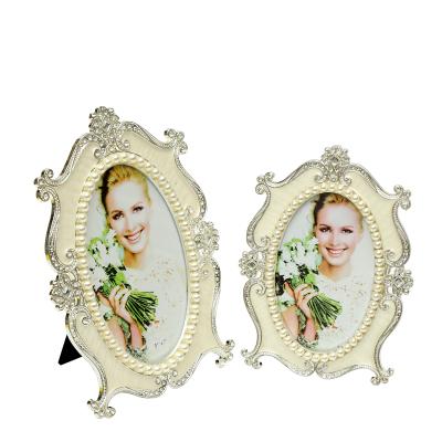 China Hot Selling European\Modern\Middle East\Africa Metal Rhinestone and Pearl Wedding Style White Picture Frames for Home Decor for sale