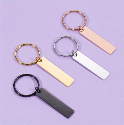 China Long Blank Keychan Ring Glossy Finish Engraved LOGO Pendant Charm Stainless Steel Fashionable Gold Plated Tag Key for sale