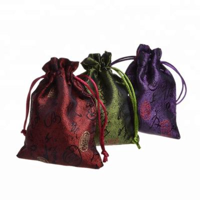 China Recyclable Ethnic Silk Drawstring Bags Brocade Gift Packaging Pouch Jewelry Trinket Storage Pouch for sale