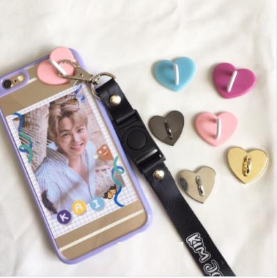 China Custom Creamy Europe Love Ellipse Quadrupe Cell Phone Hook With Adhesive Sticker for sale