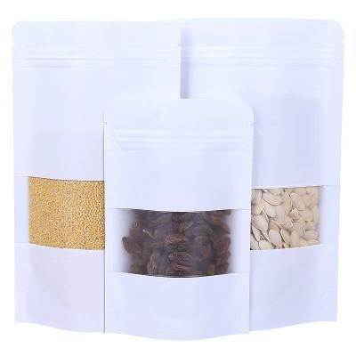 China Aseptic Custom printing brown kraft paper bags Clear Window Tea/Food Packing Stand Up Kraft Paper Ziplock Bags for sale