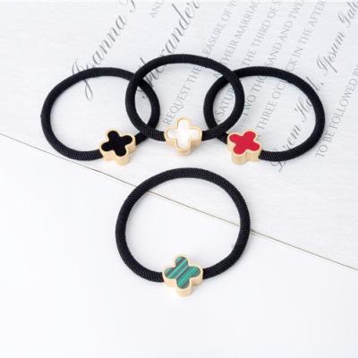 China Hair Accessories Top Selling Four Leaf Clover Hair Rope Elastic Hair Coils Rings for sale