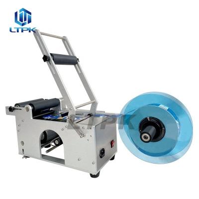 China LT-50 Semi Automatic Desktop Food Wine Jar Cans Round Bottle Adhesive Sticker Labeling Machine for Plastic Glass Bottles for sale