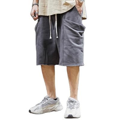 China Anti-Wrinkle Knitted Sports Shorts Logo Popular Loose Oversized Wide-Legged Basketball Five-Minute Jogging Pants for sale