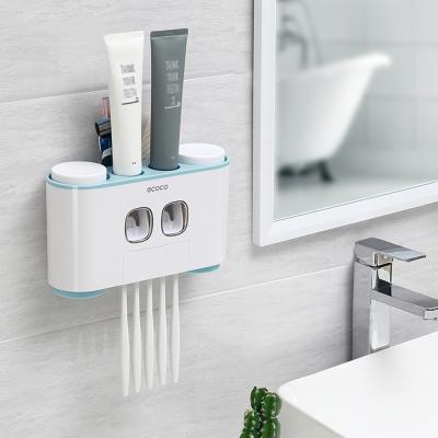 China Stylish Modern Plastic Toothbrush Holder, Automatic Toothpaste Dispenser, Wall Mounted Bathroom Storage Rack With Toothbrush Cup for sale