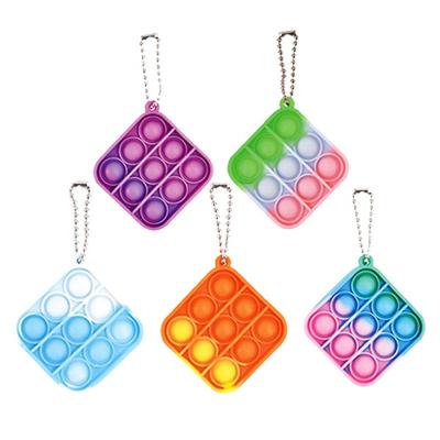 China Cute Single Silicone Bubble Jumping Mini Bag Key Chain He Key Chains Wiggle Toy Keychain Round Square for sale