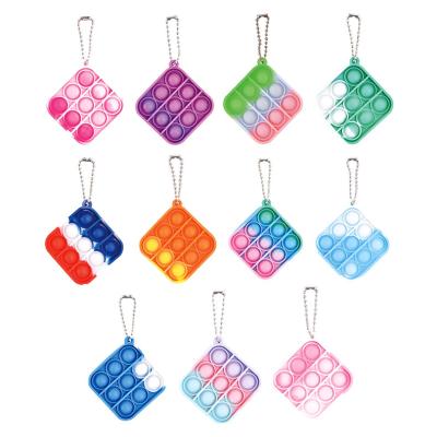 China Mini Silicone Cute Round Square Shape Push Key Chains Bubble Jumping Person Jumping Toy for sale