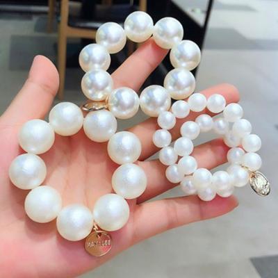 China 2020 Newest Soft Ponytail Bracelet Environmentally Friendly Simple Hair Rope Pearl Headbands Hair Accessories Women for sale