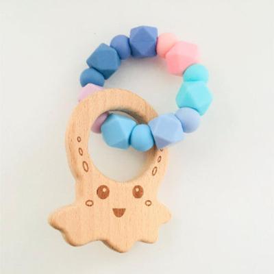 China Toy Newborn Baby Teething Soft Silicone Beads Rattle Bracelet with Wooden Ring for sale