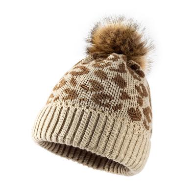 China COMMON Leopard Print Curved Wool Ball Knitted Hat Ladies Wool Hat Outdoor Custom for sale