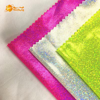 China Plain Soft UV Stretch Polyester Spandex Shiny Sparkle Fabfic for sale