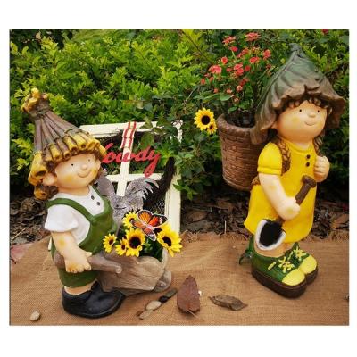 China Cute Outdoor Art Decor Handmade Boy and Girl Magnesium Oxide Garden Plant Pots Large for sale