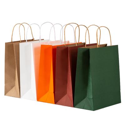 China Reusable Reusable Shopping Paper Bags 150 Gsm Kraft Paper Logo Customized Paper Bag With Twisted Handle for sale