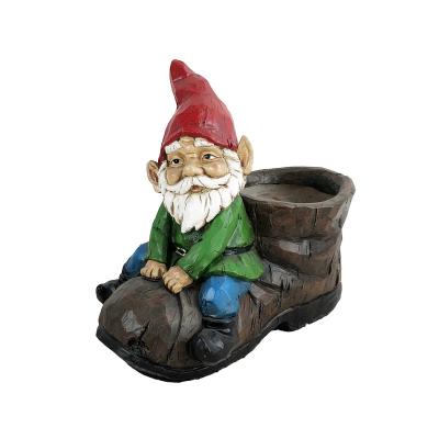 China Durable Custom Christmas Style Planters Garden Decor Cartoon Character Gnome Resin Flower Pot With Gonme Riding On a Big Shoe for sale