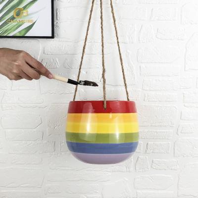 China Durable Unique Design Rainbow Handmade Painted Glaze Hanging Pot Artificial Plant Decoration Ceramic Wall Hanging Flower Pot for sale