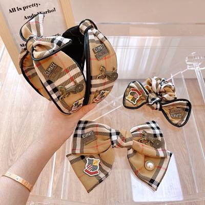 China Sweet Korea Women Fashion All-match Scrunchies Wide Edge Hair Bands For Women British Style Bow Headband for sale