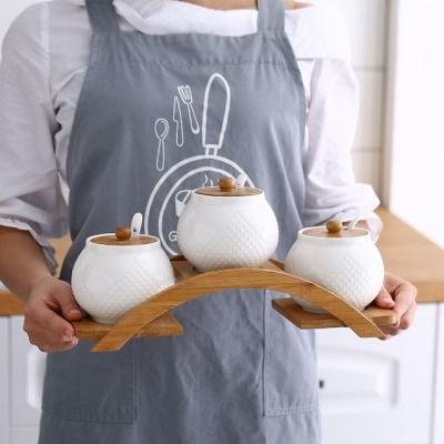 China Cute Ceramic Seasoning Spice Jar Sets 3pcs Creative Design Spice Jar Containers Kitchen Spice Salt Grinder With Wooden Rack for sale