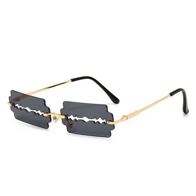 China Fashion sunglasses party unique new fashion colorful strange fashion rimless hollow blade sunglasses woman man for sale