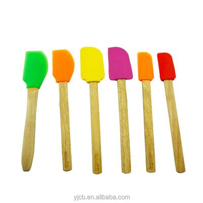 China Disposable Solid Silicone Spatula With Wooden Handle Silicone Butter Knife for sale