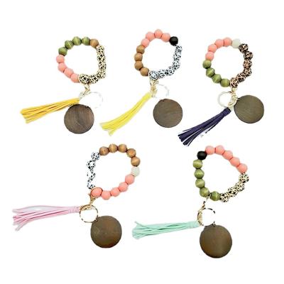 China BOHEMIA Women Wood Beads Bracelets Keychains Leopard Printed Key Chain Bangle Tassel Bracelet Kimter-Q403FZ for sale