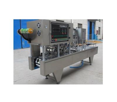 China Plastic Cup Sealer for Farms Chocolate Sauce Jelly Pudding Filling and Sealing Machine for sale