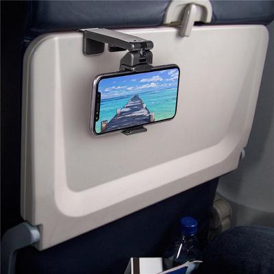 China Desktop Adjustable Universal Foldable Flight Stand Phone Travel Selfie Attendance Train Seat Stand Rotating Support for sale