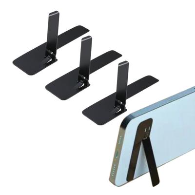 China Ultra Thin Adjustable Metal Folding Phone Holder Combine Invisible Back Desktop Stand Stick Support Portable Mobile Phone Holder for sale