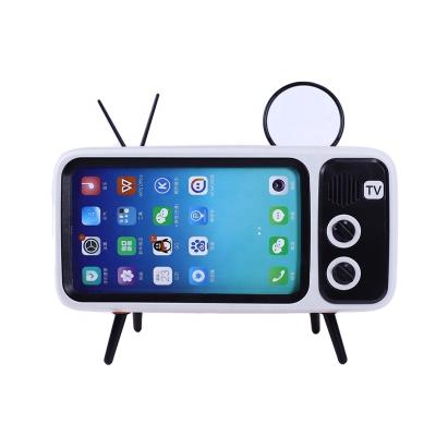 China Classic Style Wireless Mini Portable V4.2 TV Radio For Blue Tooth Speaker With Phone Holder for sale