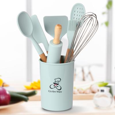 China Viable Best Selling Wooden Handle 8pcs Silicone Kitchen Utensil Accessories Set With Storage Rack for sale