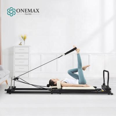 China Fitness Exercise ONEMAX 2022 Reformer Portable Pilates Pilates Reformer Steel Rollers for sale