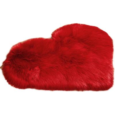 China Washable Super Soft Plush Fabric Faux Sheepskin Heart Shaped Blankets And Rugs For Living Room Home Bedroom for sale