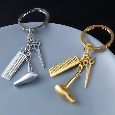 China New Metal Cast Iron Hair Dryer Keychains Mini Hair Dryer Comb Keyrings Barber Shop Gifts for sale