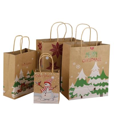 China Recyclable 12PCS Christmas Kraft Gift Bag Candy Gift Bag Hand Held In Stock Drawstring Bags for sale