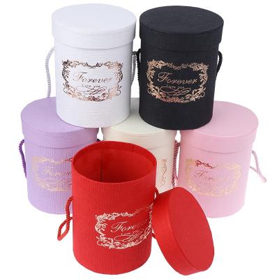 China New Recycled Materials ODM/OEM Stain Cylinder With Hand Gift Box Flower Box Small Size Embrace Bucket for sale