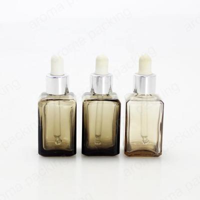 China Personal Care 10ml 15ml 30ml Smoky Gray Essential Liquid Oil E Liquid Square Glass Bottles With Silver Dropper Pipette for sale