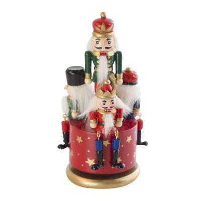 China Fashional Wooden Rotating Red Dancing Figurine Nutcracker Music Box for sale